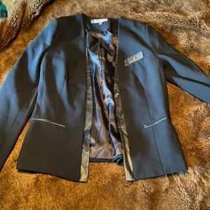 Fitted black blazer with chic faux leather detailing